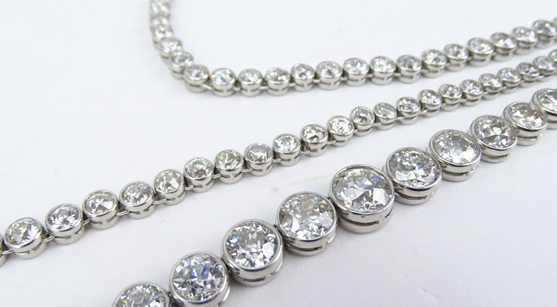 Vintage Approx. 41.0 Carat Bezel Set Graduated Round Brilliant Cut Diamond and Platinum Riviera Necklace, Diamonds F-H color, VS1-SI1 clarity.