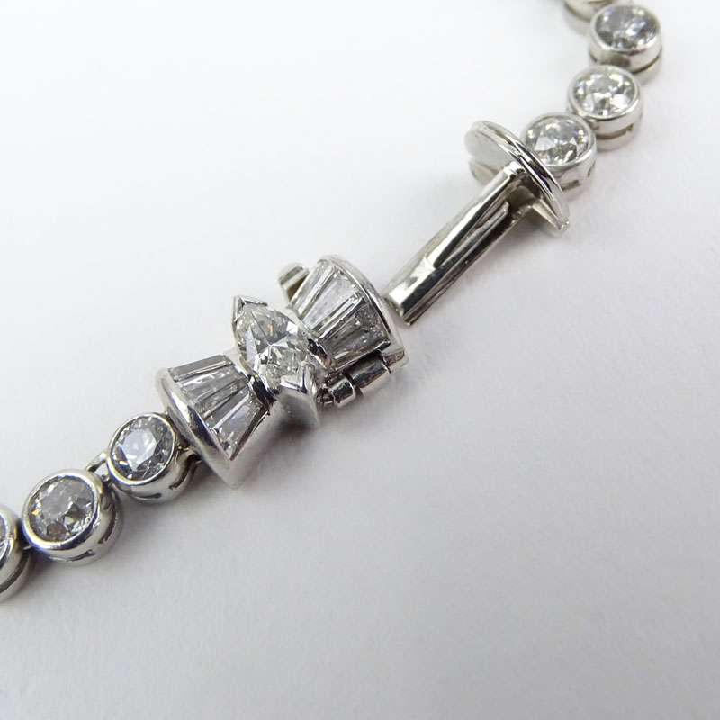 Vintage Approx. 41.0 Carat Bezel Set Graduated Round Brilliant Cut Diamond and Platinum Riviera Necklace, Diamonds F-H color, VS1-SI1 clarity.