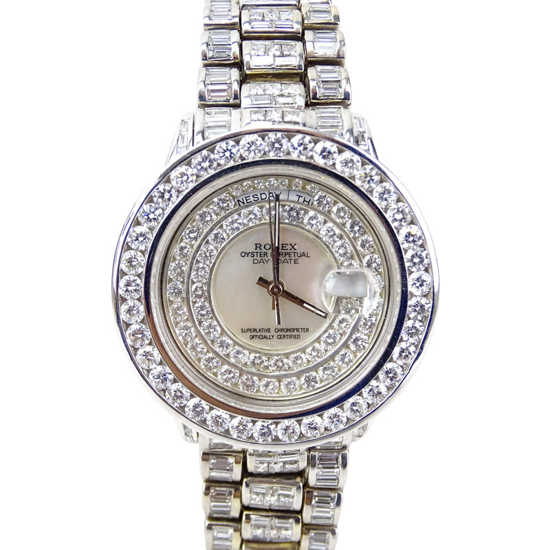 Man's Rolex 18 Karat White Gold Day Date Oyster Perpetual Set Throughout with Approx. 28.0 Carat Round Brilliant, Princess and Baguette Cut Diamonds. Diamonds D-F color, VVS-VS clarity. 