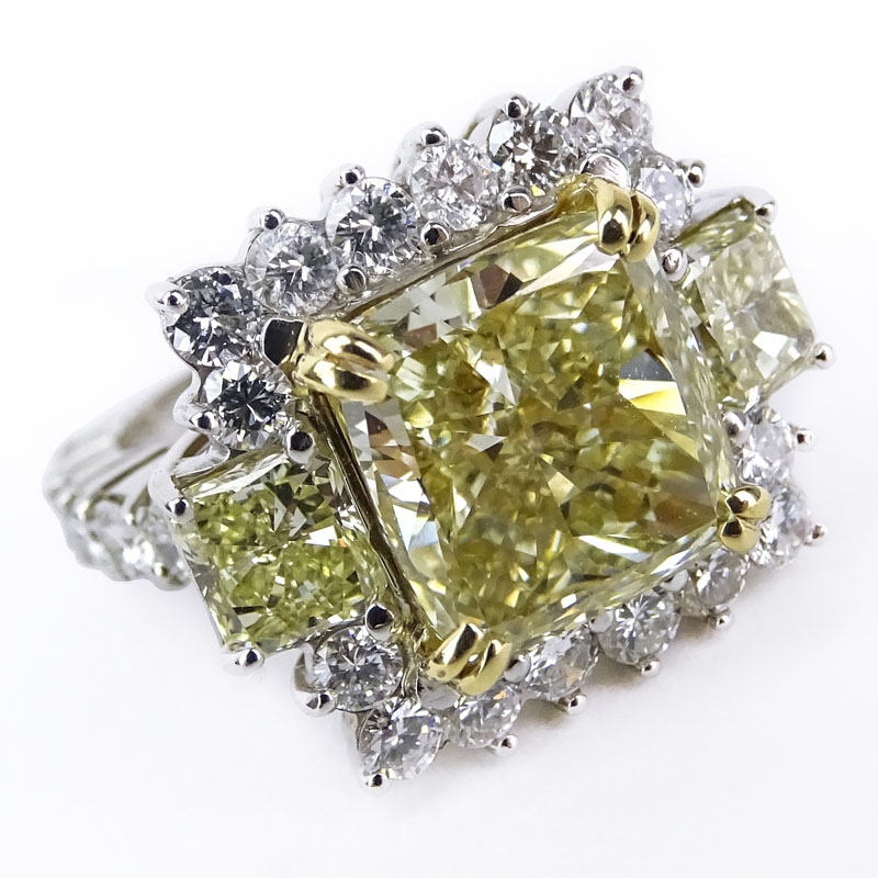 Approx. 8.71 Carat TW Fancy Yellow Diamond, White Diamond, Platinum and 18 Karat Yellow Gold Engagement Ring. 