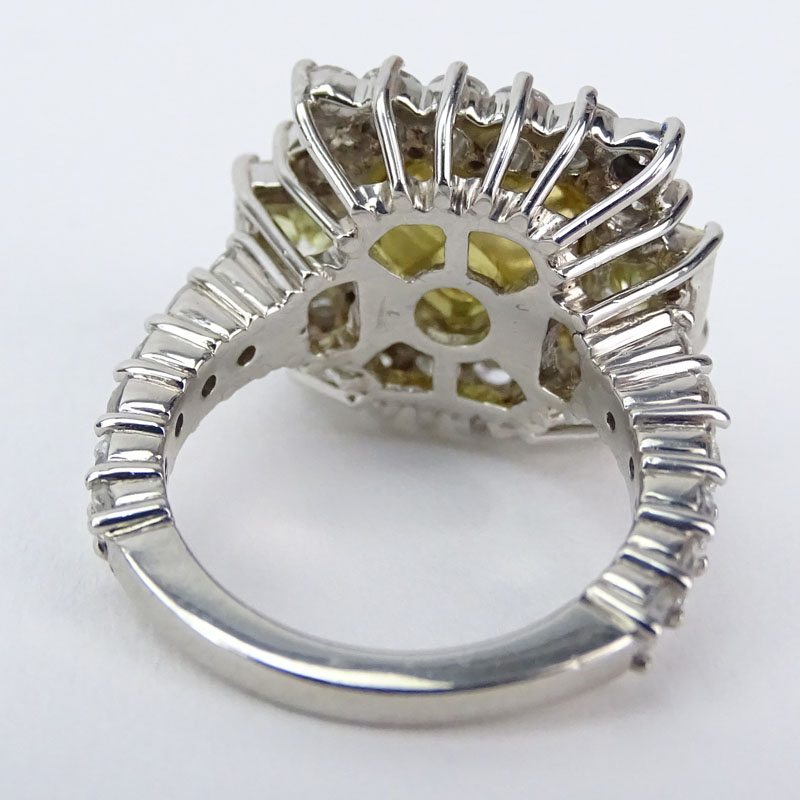Approx. 8.71 Carat TW Fancy Yellow Diamond, White Diamond, Platinum and 18 Karat Yellow Gold Engagement Ring. 