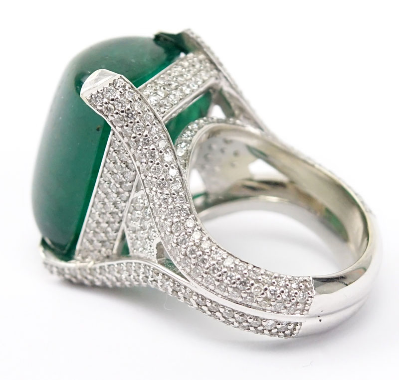 GIA Certified 25.59 Carat Sugarloaf Cabochon Emerald, Approx. 3.70 Carat Pave Set Diamond and 18 Karat White Gold Ring. 