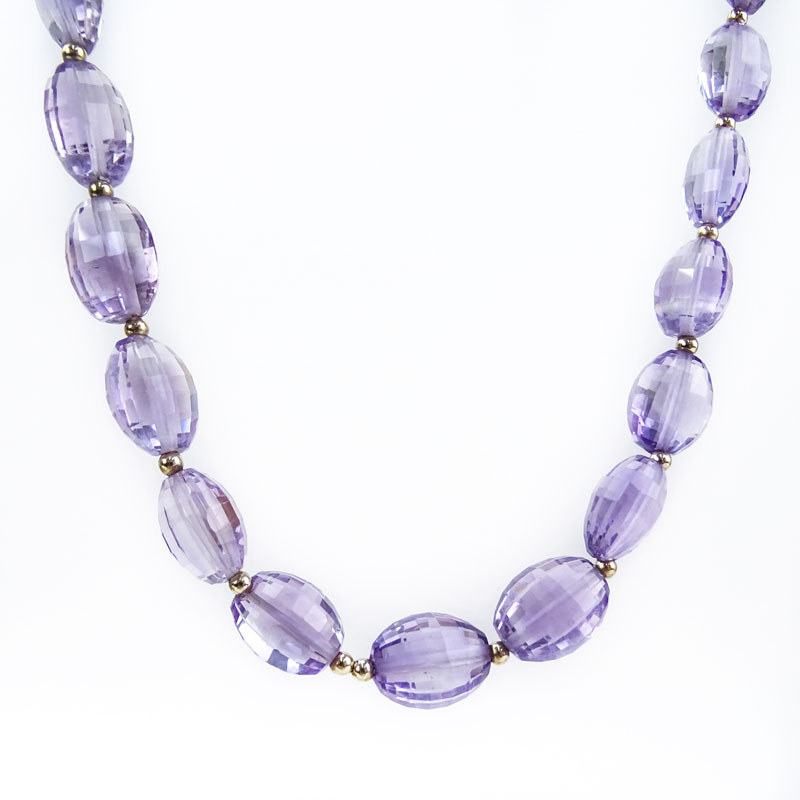 Approx. 162.0 Carat Oval Briolette Cut Graduated Amethyst Bead and 14 Karat Yellow Gold Necklace.