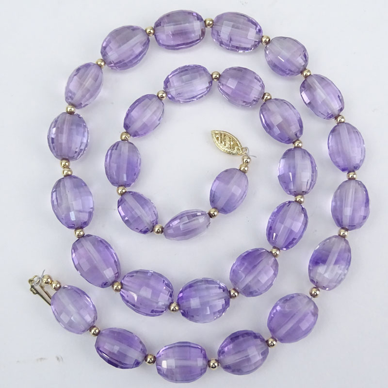 Approx. 162.0 Carat Oval Briolette Cut Graduated Amethyst Bead and 14 Karat Yellow Gold Necklace.