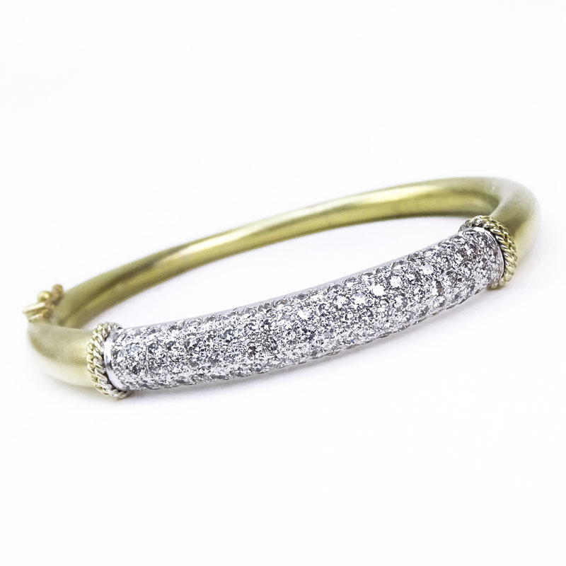 Approx. 3.30 Carat Pave Set Round Brilliant Cut Diamond and 14 Karat Yellow and White Gold Hinged Bangle Bracelet.