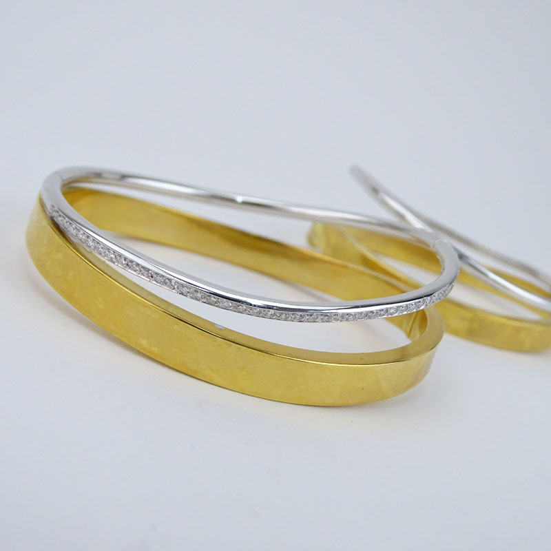 Pair of Pave Set Diamond, 18 Karat White and Yellow Gold Hinged Bangle Bracelets. 