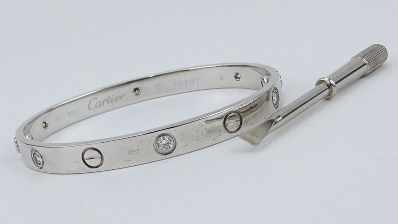 Circa 2005 Cartier 18 Karat White Gold and Six (6) Round Brilliant Cut Diamond Love Bracelet with Box, Cartier Certificate and Screwdriver. 