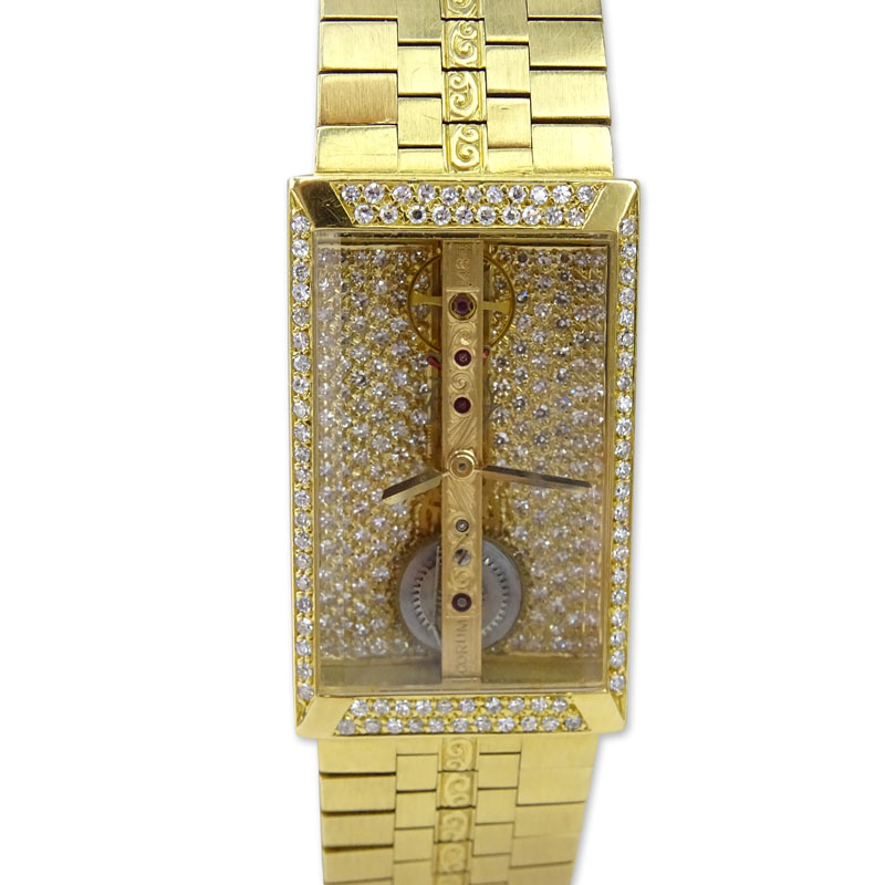 Man's Vintage Corum 1484 Pave Set Diamond and 18 Karat Yellow Gold Bridge Skeleton Bracelet Watch with Automatic Movement.