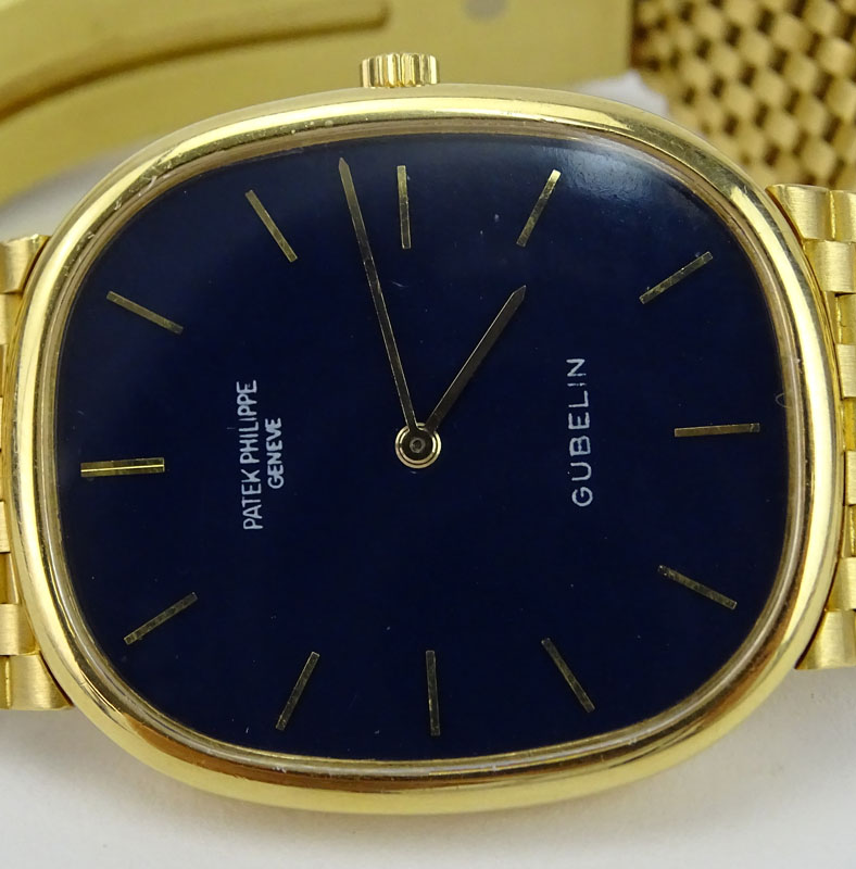 Man's Vintage Patek Philippe Gubelin Golden Ellipse 18 Karat Yellow Gold Bracelet Watch with Automatic Movement.