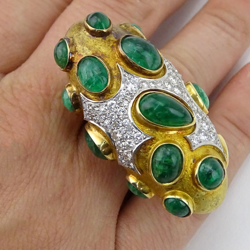 Circa 1968 Roger Lucas (20th century) Montreal, Canada Approx. 16.0-18.0 Carat Sixteen (16) Cabochon Colombian Emerald, 5.5-6.0 Carat Pave Set Diamond and Heavy 18 Karat Yellow Gold Three Finger Ring. 