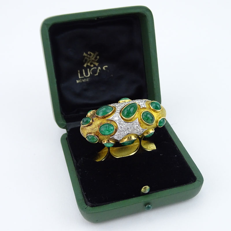 Circa 1968 Roger Lucas (20th century) Montreal, Canada Approx. 16.0-18.0 Carat Sixteen (16) Cabochon Colombian Emerald, 5.5-6.0 Carat Pave Set Diamond and Heavy 18 Karat Yellow Gold Three Finger Ring. 