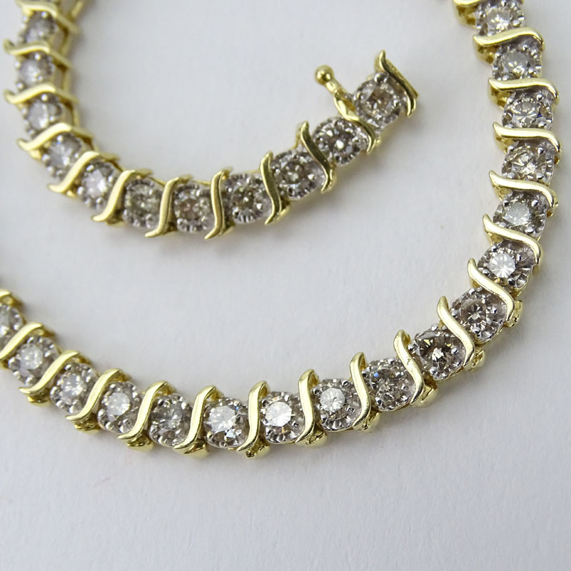 Vintage Approx. 5.0 Carat Round Brilliant Cut Diamond and 14 Karat Yellow Gold Tennis Bracelet.