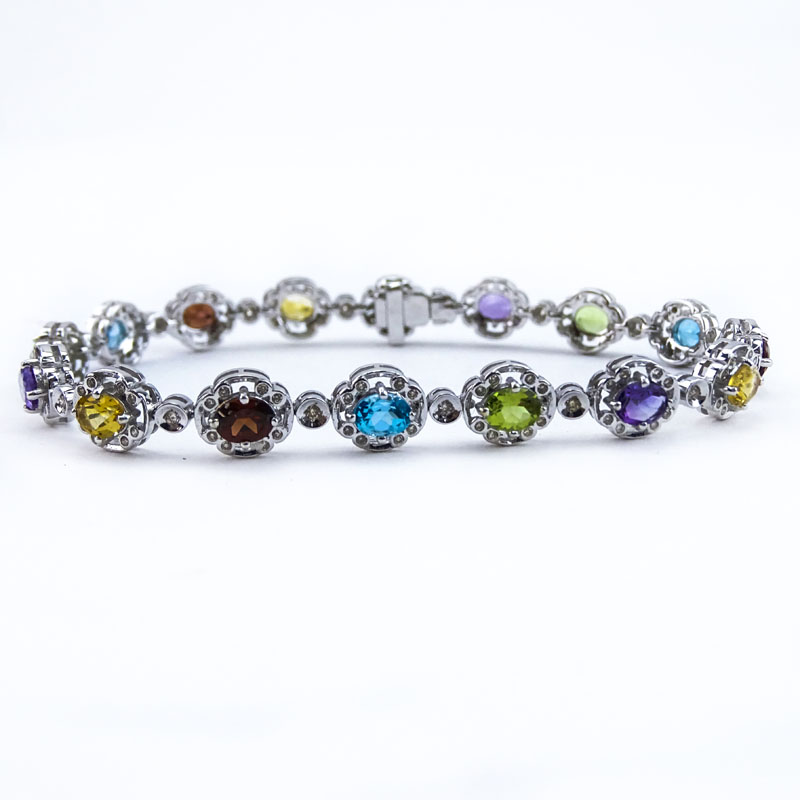 Approx. 5.40 Carat Oval Cut Multi Stone, .73 Carat Round Cut Diamond and 18 Karat White Gold Bracelet. 