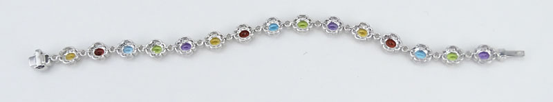 Approx. 5.40 Carat Oval Cut Multi Stone, .73 Carat Round Cut Diamond and 18 Karat White Gold Bracelet. 