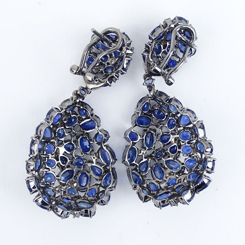 Approx. 30.0 Carat Oval Cut Sapphire, .50 Carat Round Brilliant Cut Diamond and 18 Karat White Gold Pendant Earrings. 