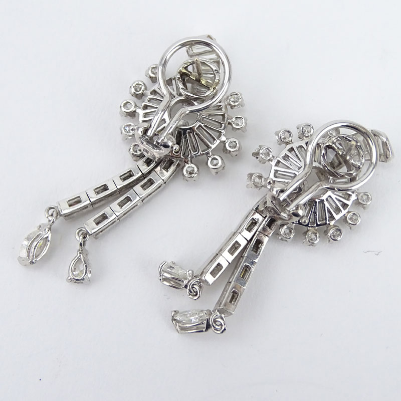 Circa 1940s Approx. 4.0 Carat Baguette and Round Brilliant Cut Diamond and Platinum Earrings.