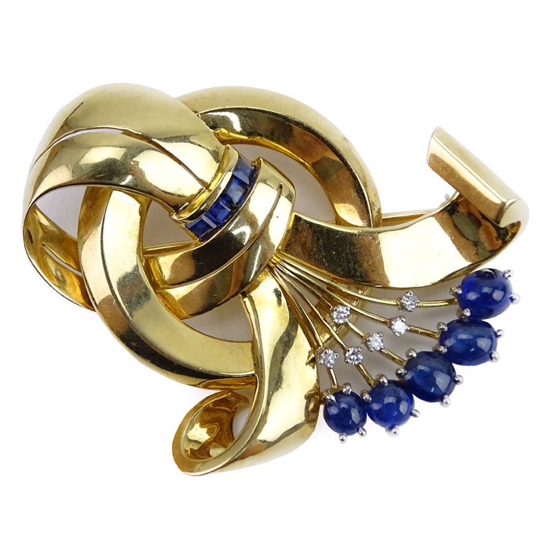 Retro 1950s Cabochon and Calibre Cut Sapphire, .35 Carat Round Brilliant Cut Diamond and 14 Karat Yellow Gold Brooch. 