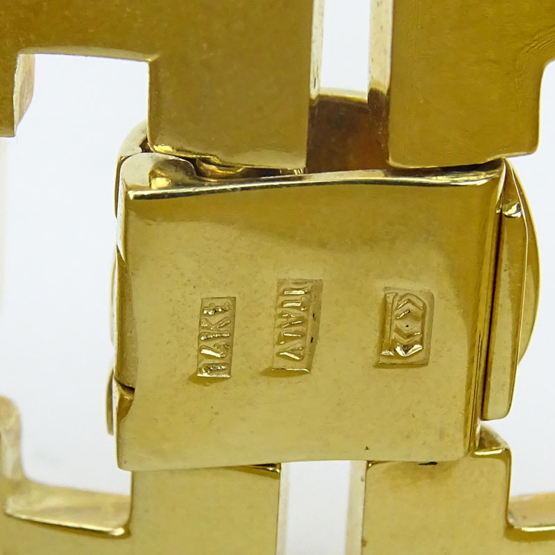 Retro Circa 1960s Italian 14 Karat Yellow Gold Wide Bracelet Set with Two (2) Princess Cut CZ. Stamped Italy 14K and maker's mark.