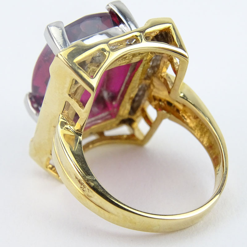 Large Oval Criss Cross Cut Rubelite Tourmaline, Diamond and 18 Karat Yellow Gold Ring. 