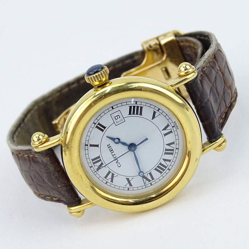 Vintage Cartier 18 Karat Yellow Gold Watch with Swiss Quartz Movement, Leather Strap and 18 Karat Yellow Gold Deployment Buckle. 