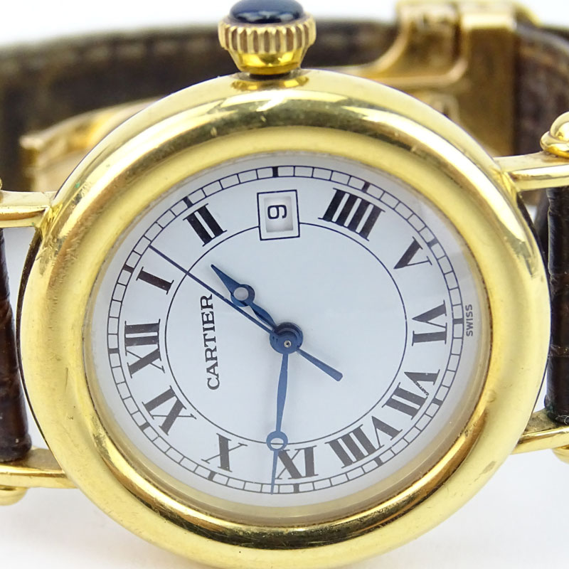 Vintage Cartier 18 Karat Yellow Gold Watch with Swiss Quartz Movement, Leather Strap and 18 Karat Yellow Gold Deployment Buckle. 