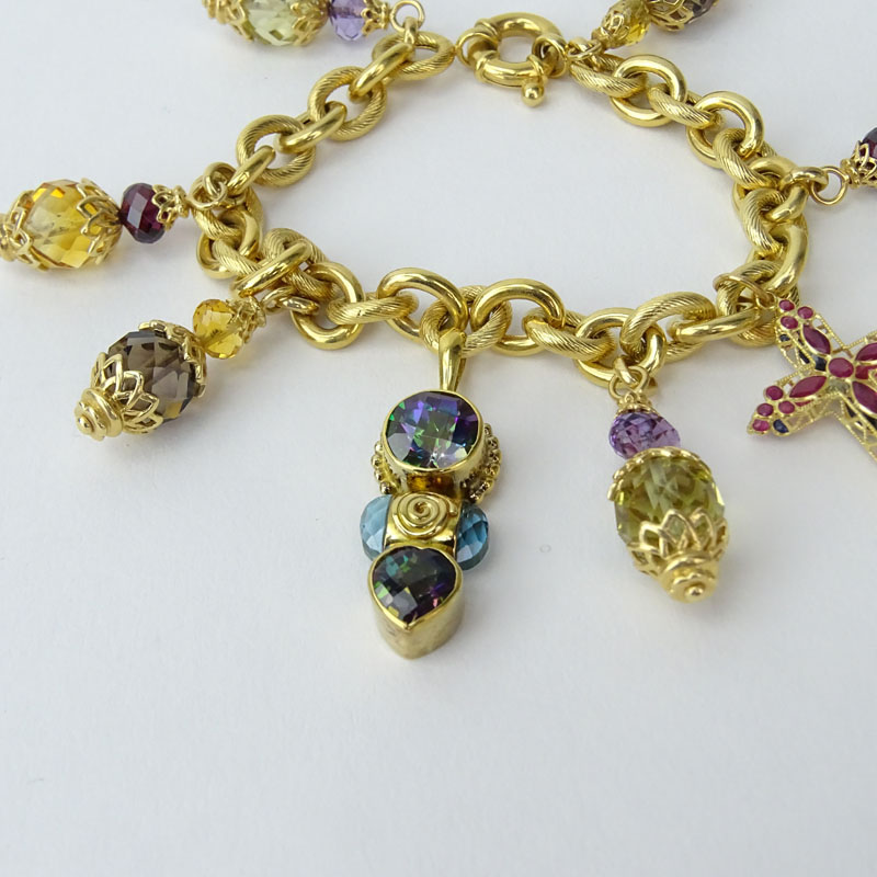 Vintage 14 Karat and 18 Karat Yellow Gold and Multi Gemstone Charm Bracelet and Ring Suite.