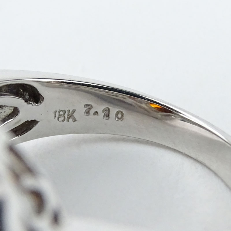 Vintage Approx. 7.10 Carat  Oval Cut Garnet, Baguette and Round Brilliant Cut Diamond and 18 Karat White Gold Ring.