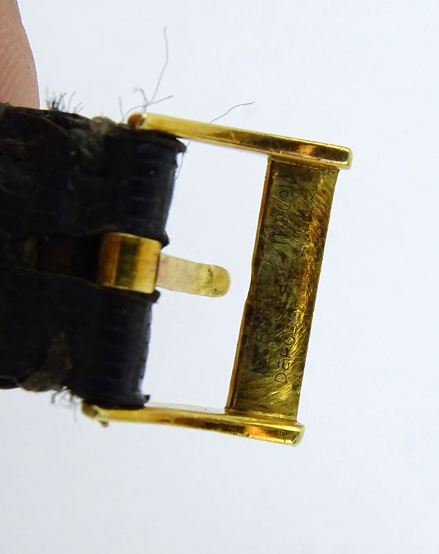 Vintage Patek Philippe 18 Karat Yellow Gold Manual Movement Watch with Leather Strap and 18 Karat Yellow Gold Buckle.