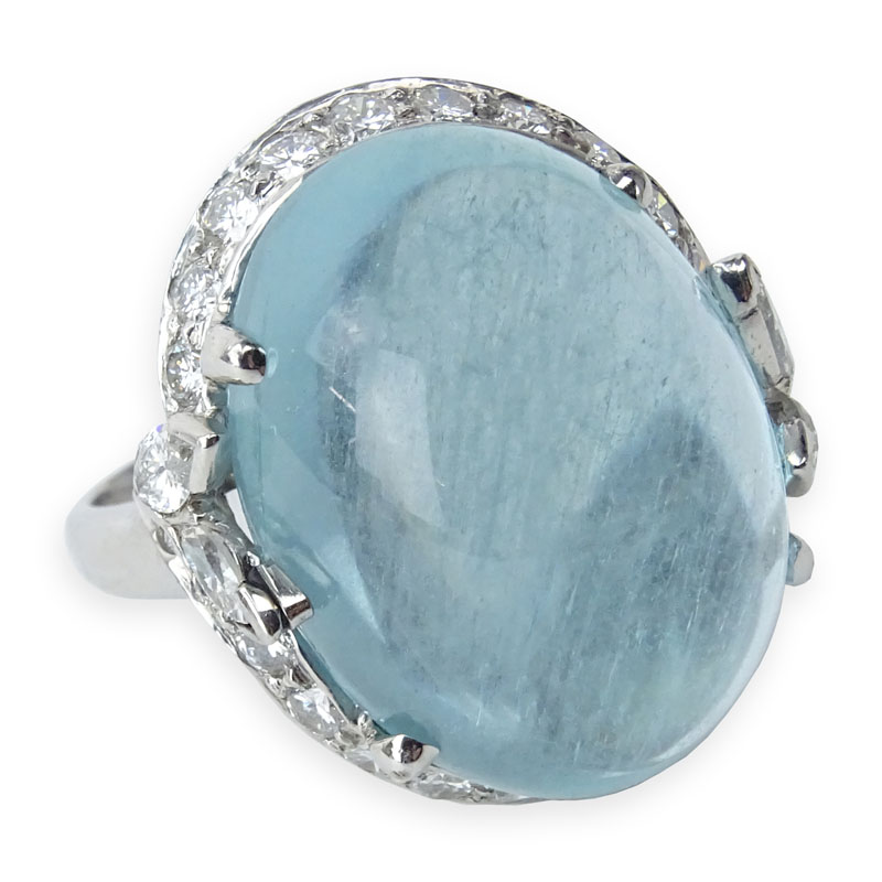 Vintage Approx. 29.50 Carat Oval Cabochon Aquamarine, 1.75 Carat Round Brilliant and Marquise Cut Diamond and Platinum Ring. 