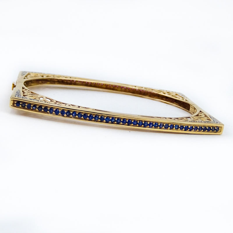 Fine 14 Karat Yellow Gold, Diamond, Round Cut Sapphire and Ruby Openwork Square Form Hinged Bangle Bracelet.