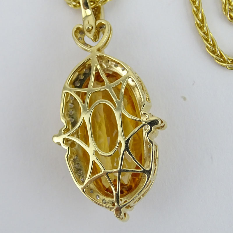 Criss Cross Citrine, Pave Set Diamond and 14 Karat Yellow Gold Pendant Necklace and Earring Suite. 