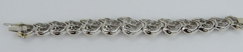 Approx.. 18.76 Carat (126) Round Brilliant and Baguette Cut Diamond and 18 Karat White Gold Bracelet.