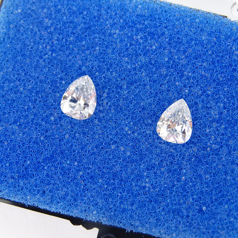 Two (2) GIA Certified Antique Pear Shape Diamonds.