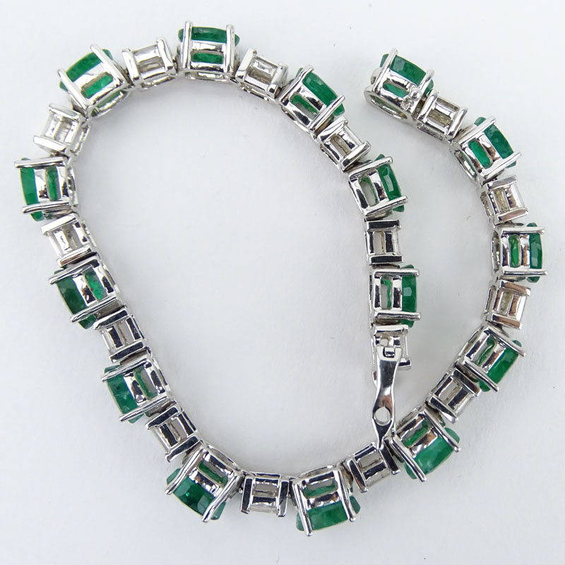 Approx. 12.48 Carat Oval Cut Emerald, 1.80 Carat Baguette Cut Diamond and 14 Karat White Gold Bracelet. 