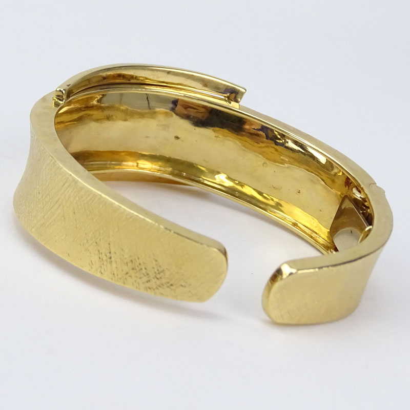 Vintage Sonia Britton 14 Karat Yellow Gold Hinged Bangle Bracelet with 10 Round Cut Diamond Accents.