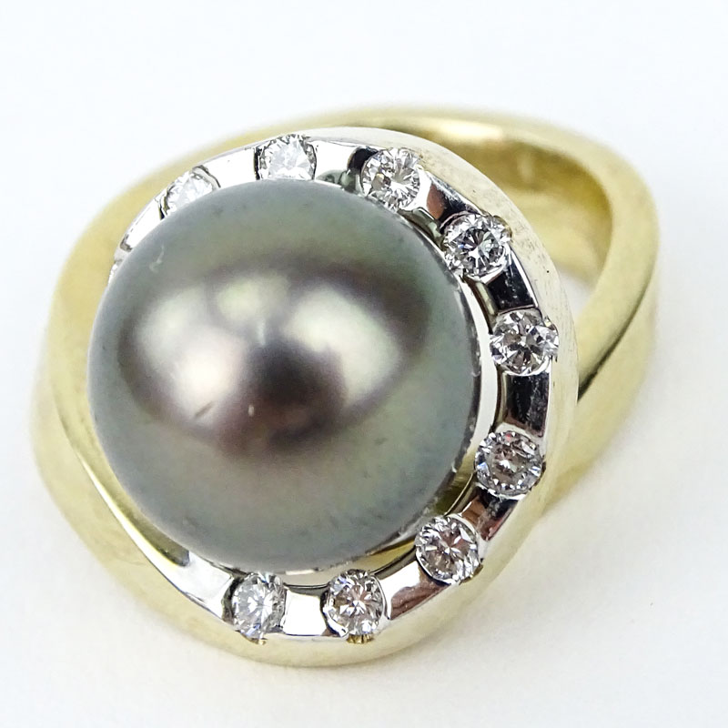 Approx. .65 Round Brilliant Cut Diamond, 11mm Tahitian Black Pearl, 14 Karat Yellow Gold Retro Style Ring. 