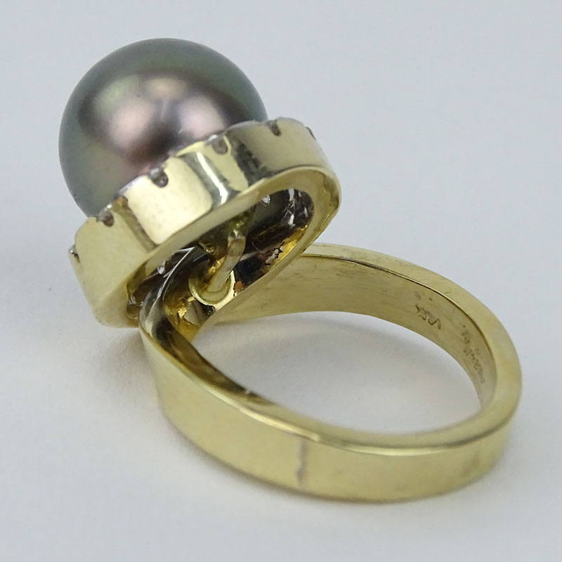 Approx. .65 Round Brilliant Cut Diamond, 11mm Tahitian Black Pearl, 14 Karat Yellow Gold Retro Style Ring. 