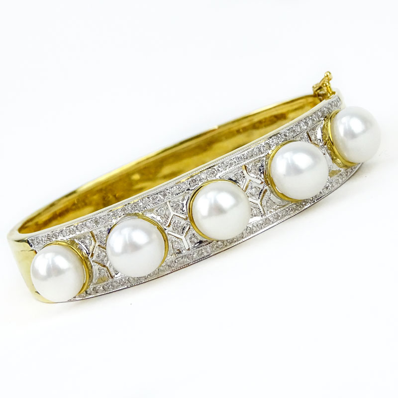 Finely Made Pave Set Diamond, South Sea Pearl and 18 Karat Yellow Gold Hinged Bangle Bracelet. 