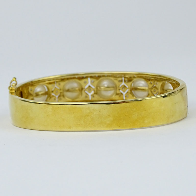 Finely Made Pave Set Diamond, South Sea Pearl and 18 Karat Yellow Gold Hinged Bangle Bracelet. 