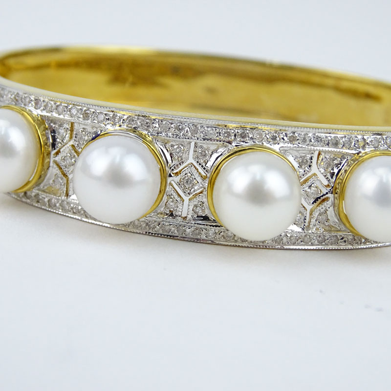 Finely Made Pave Set Diamond, South Sea Pearl and 18 Karat Yellow Gold Hinged Bangle Bracelet. 