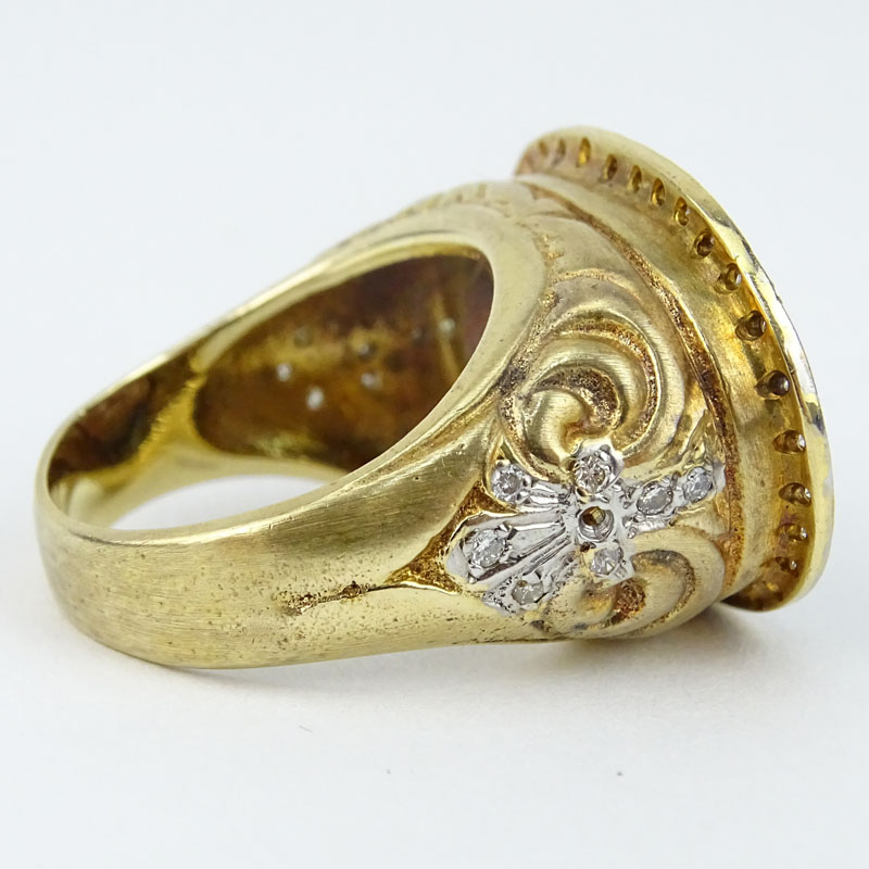 Vintage 14 Karat Yellow Gold, .70 Carat Round Brilliant Cut Diamond and Red Quartz Ring. 