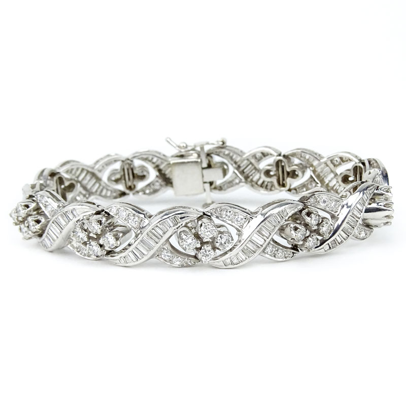 Retro Lady's Round Brilliant Cut and Baguette Diamond and Platinum Bracelet.