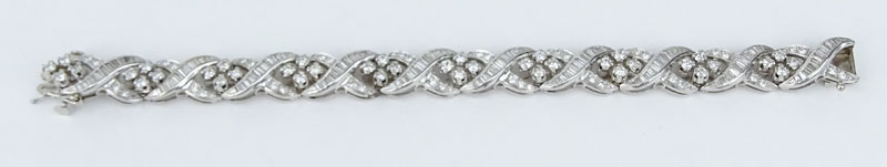 Retro Lady's Round Brilliant Cut and Baguette Diamond and Platinum Bracelet.