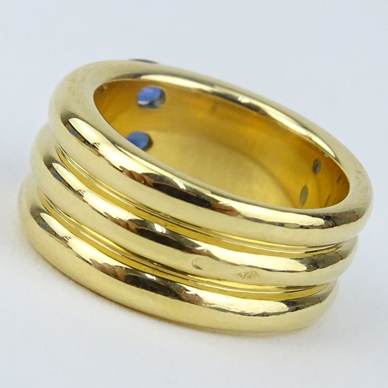 Cartier Approx. 1.10 Carat Oval Cut Sapphire and  18 Karat Yellow Gold 10mm Triple Stack Band Ring.