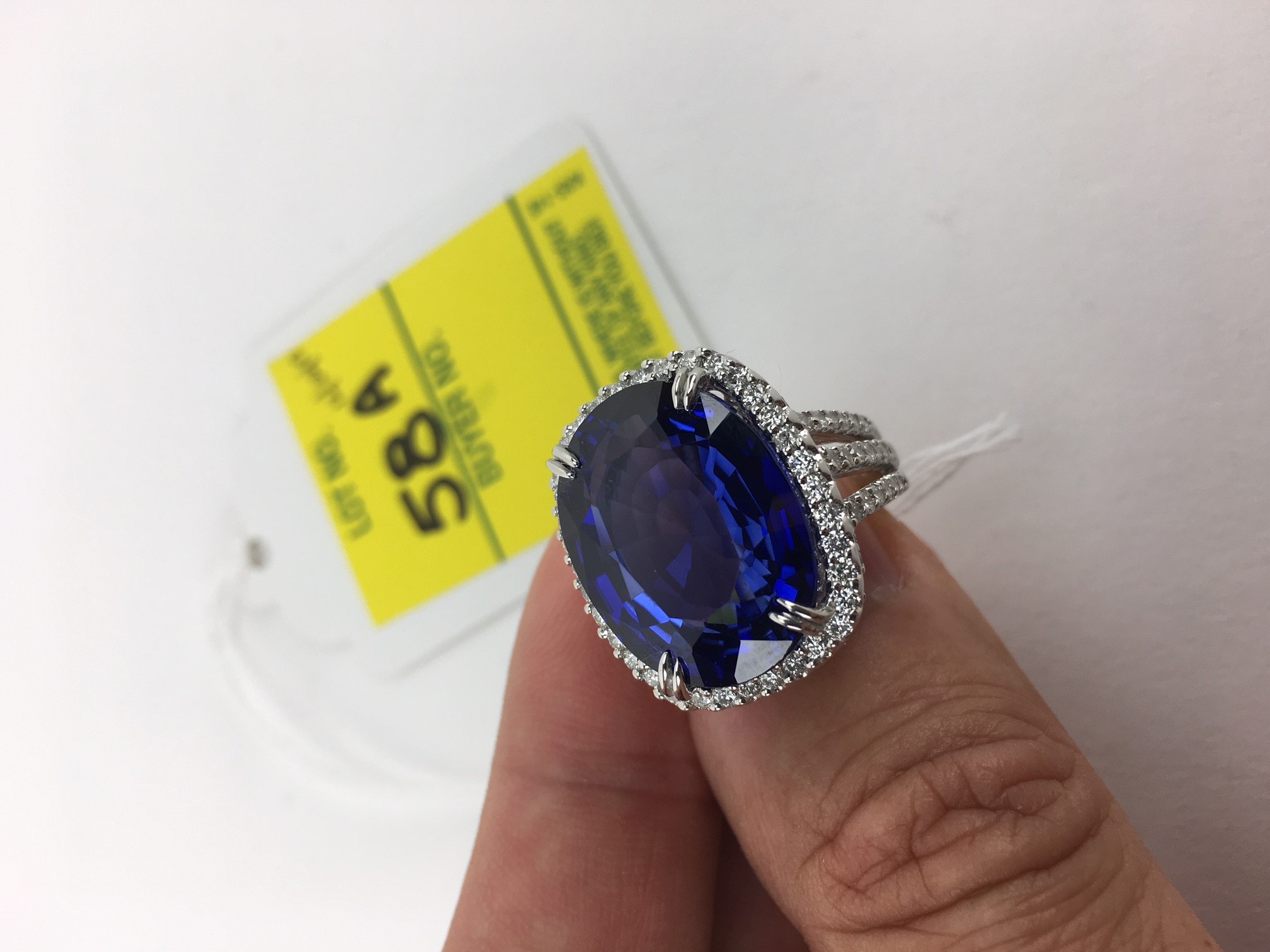 24.14 Carat Oval Cut Royal Blue Sapphire, 2.08 Carat Round Brilliant Cut Diamond and 18 Karat White Gold Ring. 