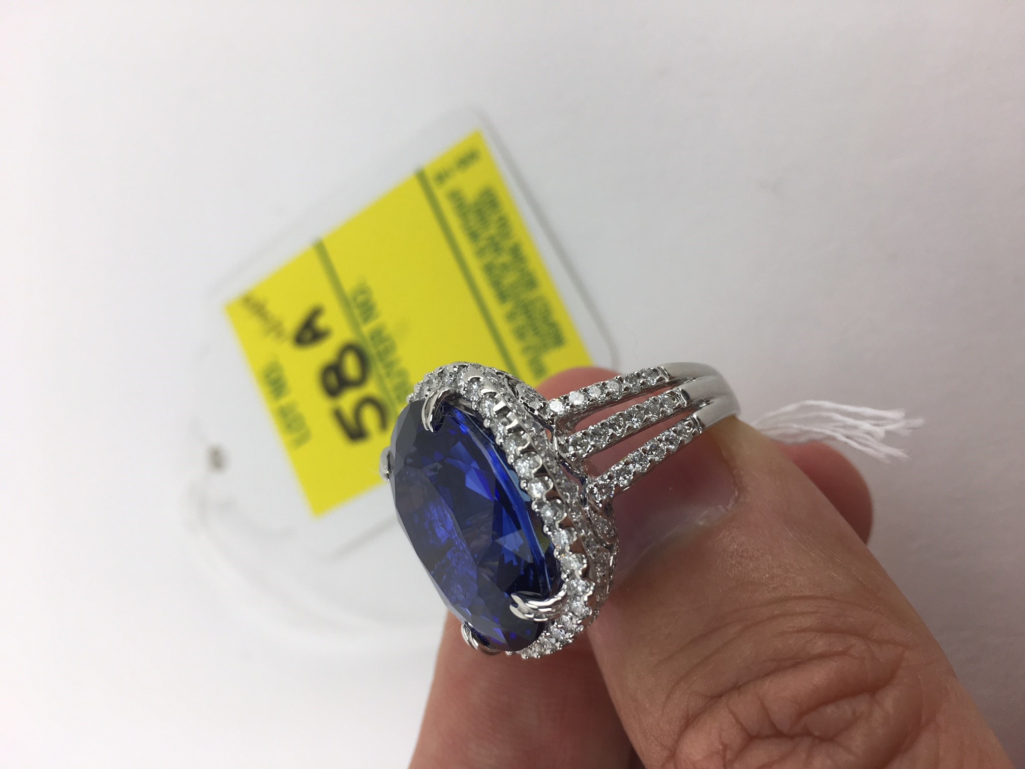 24.14 Carat Oval Cut Royal Blue Sapphire, 2.08 Carat Round Brilliant Cut Diamond and 18 Karat White Gold Ring. 