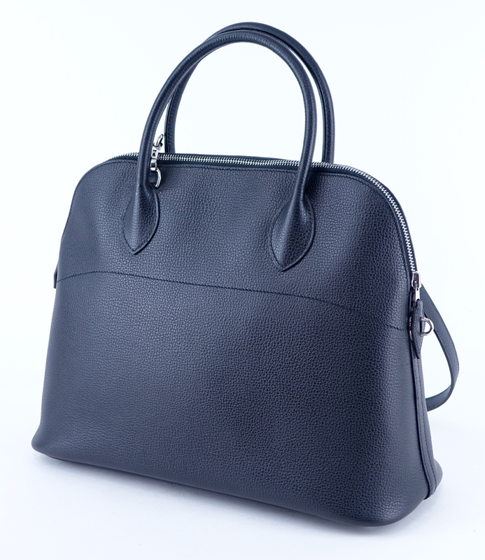 Hermès Black Ardennes Bolide 37 Bag. Palladium hardware, clochette, zipper closure, optional shoulder strap, slot pocket on interior.