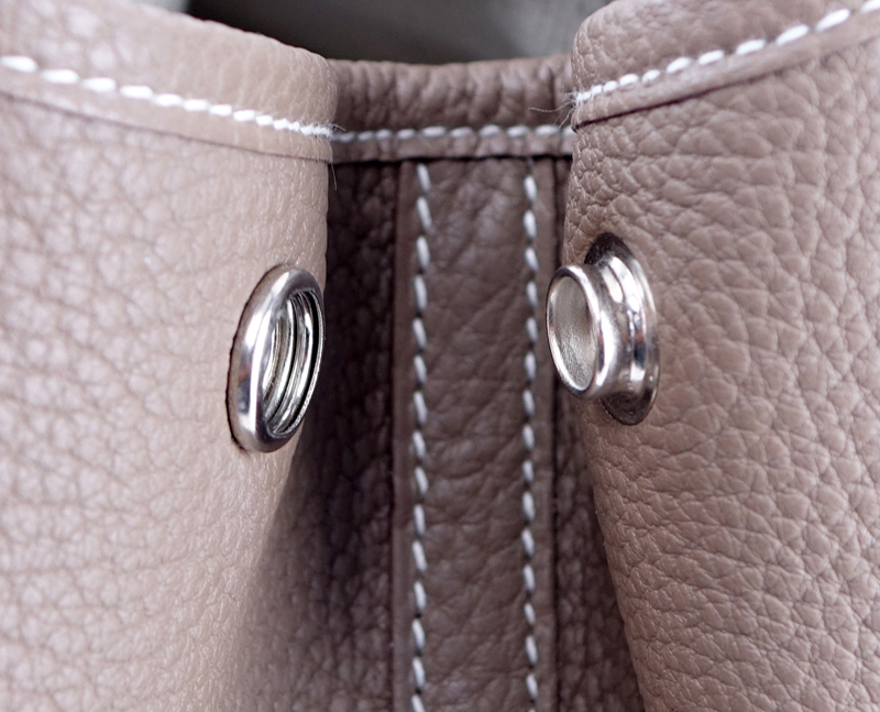 Hermes Etoupe Garden Party 36 Bag. Ivory herringbone fabric interior with zipper and patch pockets, snap closure.
