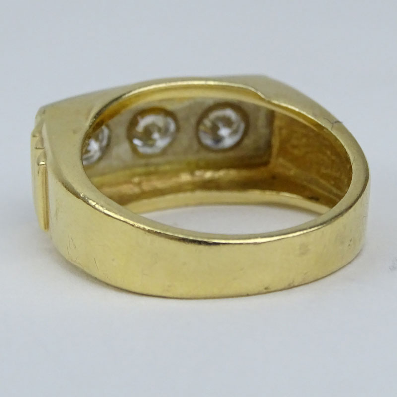 Men's Vintage Round Brilliant Cut Diamond and 14 Karat Yellow Gold Three Stone Ring.