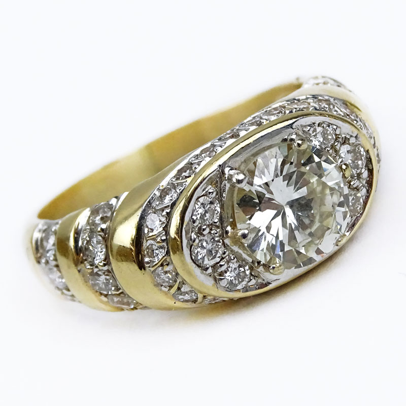 Man's Vintage Approx. 1.95 Carat Round Brilliant Cut Diamond and 18 Karat Yellow Gold Ring accented throughout with Approx. 2.0 Carat Pave Set Round Brilliant Cut Diamonds.